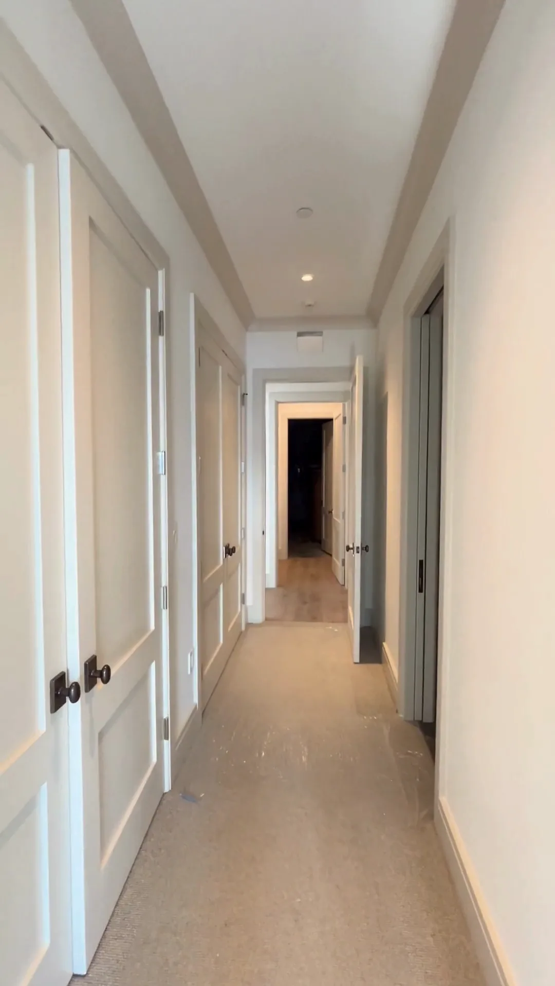 Hallway with white doors and trims after interior painting