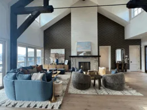 Wide view of living room featuring wallpaper painting installation on accent walls